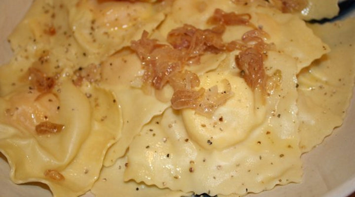 Goat Cheese Ravioli W/ Caramelized Shallots & Mushroom-Sage Cream Sauce